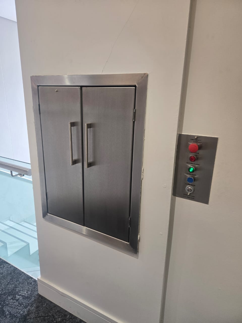 Stainless steel dumbwaiter doors and controls