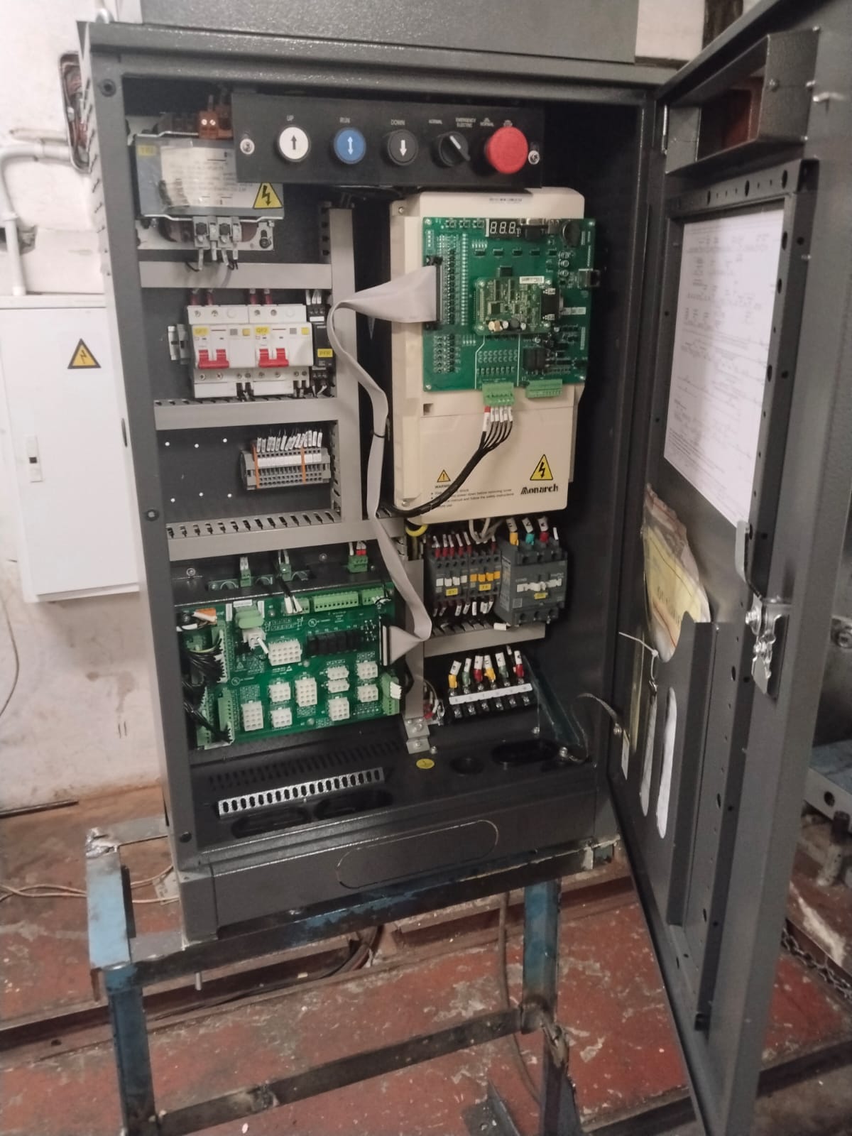 Open elevator controller cabinet for maintenance checks